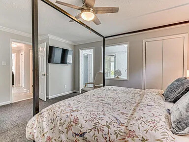 Second bedroom with upholstered headboard